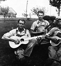 3 guys playing guitars